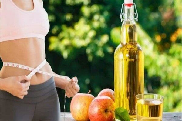 Massage vùng bụng với giấm táo